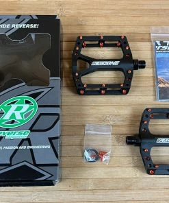 Reverse Components Black One Plattformpedale / Pedale Schwarz/orange